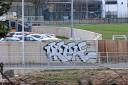 Graffiti has appeared on a section of Hawick's flood defence wall