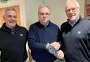HONOUR: John Rutherford (right) presents new cap Kenny Trotter with a club tie in the Philiphaugh Suite on Saturday, watched by Selkirk president David Anderson. Photo: John Smail