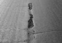 An image of a pothole. Photo: Unsplash/Anja Bauermann