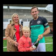Angela and Atholl Gillie (mascot) present Danny Galbraith with his champagne following 1-1 draw with Hearts B