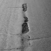 An image of a pothole. Photo: Unsplash/Anja Bauermann