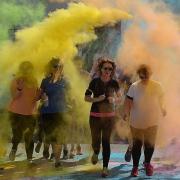 Runners were greeted with a colourful explosion. Photos: Alwyn Johnson