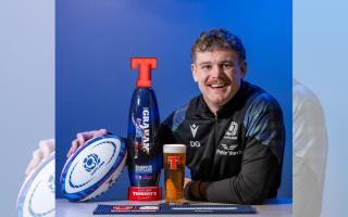Hawick rugby star Darcy Graham with his Tennent's Lager Tournament Tap