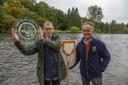 Ecologist and citizen scientist, John Clayton from Tweedbank receives the 2022 Tweed Forum River Champion Award from Tweed Forum Director, Luke Comins. Photo: Phil Wilkinson