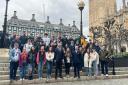 Pupils from Galashiels Academy with MP John Lamont in New Palace Yard overlooking Big Ben
