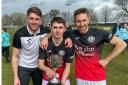 Quinn Mitchell (centre) with East of Scotland Cup. Gareth Rodger (left) and Danny Galbraith (right)