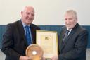SBC convener Watson McAteer presents last year's winner Murray Whyte (right) with Tweeddale's Citizen of the Year certificate
