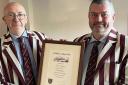Selkirk Cricket Club president Neil Gentleman (left) presents Chris Highton with his life membership certificate.  (Photo – JOHN SMAIL)
