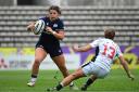 Lisa Thomson carries the ball against USA. Photo: Getty/World Rugby