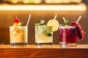 Stock image of three cocktails. Photo: Unsplash/Kobby Mendez