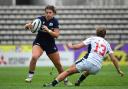 Lisa Thomson carries the ball against USA. Photo: Getty/World Rugby