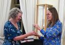 Dorothy Coe receiving her award from Sara Cameron McBean, coordinator of the Scottish Story Awards. Photo: Sam Coe