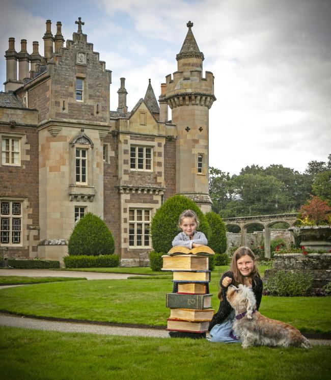 Hollie McLean (age 6, left) and Lucy Brown (age 8, right) with Lucy, the Dandie Dinmont Terrior, at Abbotsford to mark the return of the Baillie Gifford Borders Book Festival, 2-7 November