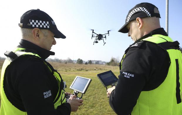 Border Telegraph: Insp Nick Whyte, left, and Sgt Steven Pollock of the Police Scotland Air Support Unit control a drone at Jackton, East Kilbride. MISSING PERSONS feature STY..Pic Gordon Terris Herald & Times..23/3/22.