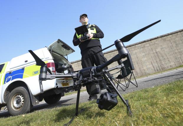 Border Telegraph: Sgt Steven Pollock of the Police Scotland Air Support Unit with drone at Jackton, East Kilbride. MISSING PERSONS feature STY..Pic Gordon Terris Herald & Times..23/3/22.