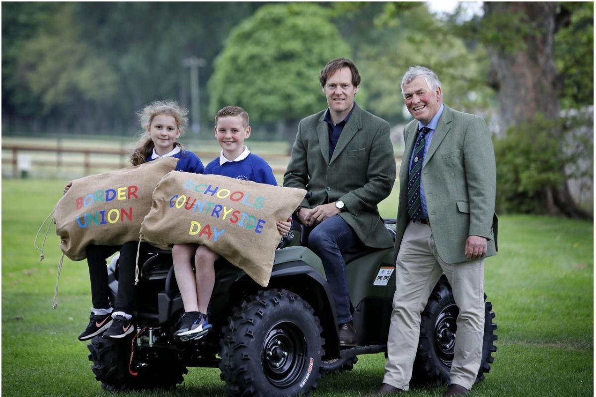 Representing the Fallago Environment Fund, His Grace The Duke of Roxburghe (seated) gets ready to welcome primary five children from across the Scottish Borders to the Border Union Schools Countryside Day at the Borders Events Centre on Tuesday 17 May.