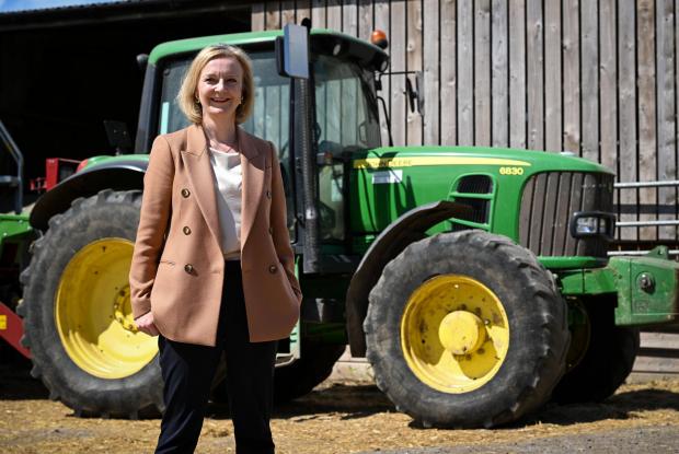 Border Telegraph: Liz Truss, during her visit to Twelve Oaks Farm in Newton Abbot, Devon, as part of her campaign to be leader of the Conservative Party and the next prime minister. Picture date: Monday August 1, 2022.