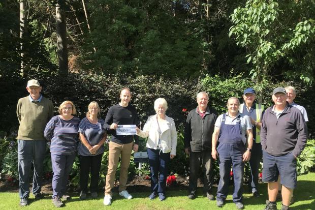 Judith Cleghorn and Craig Murray (centre) with Gala in Bloom volunteers at Bank Street Gardens. Photo: Isabelle Truscott