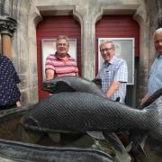Bonnie Peebles Plus restored the fish sculpture outside the Eastgate Theatre to its former glory. L-R: Robin Tatler, Norman Elder, John Falla, Roy Carnwall