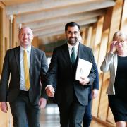 Newly elected leader of the Scottish National Party (SNP), Humza Yousaf, with Neil Gray (left) and Shona Robison, arriving at the Scottish Parliament in Edinburgh ahead of the vote to confirm the new First Minster of Scotland. Photo: Jane Barlow/PA Wire