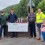 Members of Selkirk Community Council receiving a cheque from Oregon Timber Frame Ltd. Photo: Selkirk Community Council