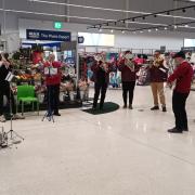 Town Band bring tidings of comfort and joy for Asda customers in Galashiels today