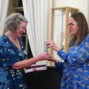 Dorothy Coe receiving her award from Sara Cameron McBean, coordinator of the Scottish Story Awards. Photo: Sam Coe