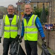 Denis Robson and Murray Charters collecting litter