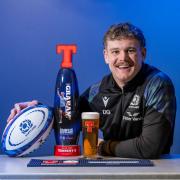 Hawick rugby star Darcy Graham with his Tennent's Lager Tournament Tap
