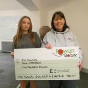 Isla Paterson receiving her grant from Shirley Marr, of Rowan Boland Memorial Trust