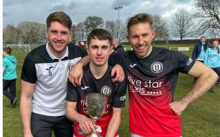 Quinn Mitchell (centre) with East of Scotland Cup. Gareth Rodger (left) and Danny Galbraith (right)