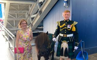 Clare Wildsmith with Regimental Mascot of The Royal Regiment of Scotland Corporal Cruachan IV  (centre) and his handler